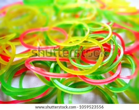 Thin slices of rubber bands in various colors
