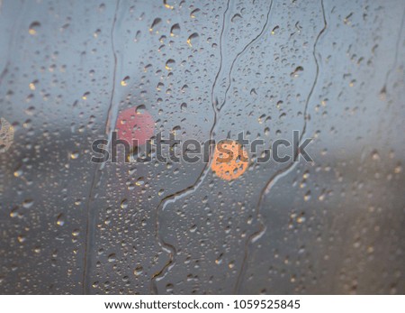 Rain drops at the window and bokeh 