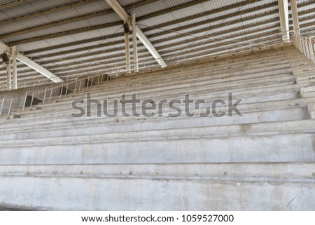 Empty mortar seats in football stadium.