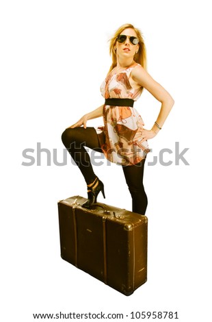 Beautiful blond young woman with suitcase, dressed in retro style. Isolated on white background