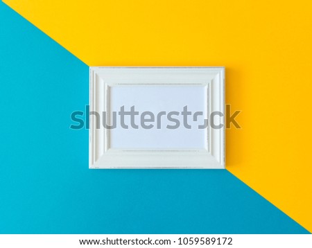 white photo frame on a colored background. mock up, copy space