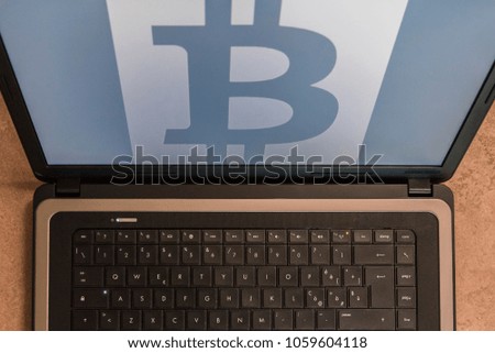 Bitcoin symbol on the screen 