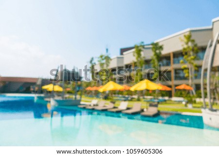 Abstract blur defocused swimming pool in luxury hotel resort for background