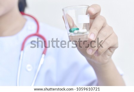 Medication treatments, close up hand of physician holding drugs
