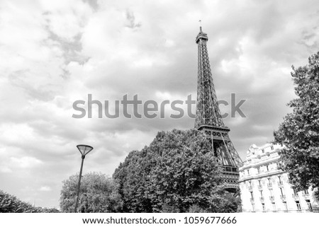 Eiffel Tower at sunset in Paris, France. Romantic travel background. Eiffel tower is traditional symbol of paris and love.