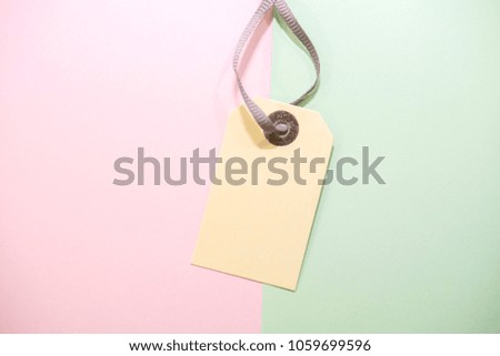 blank price tag on  pastel background in minimal style .flat lay,top view