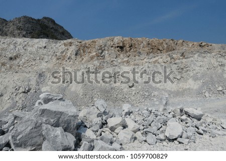 Bench of blasted limestone in limestone mining, quarry.