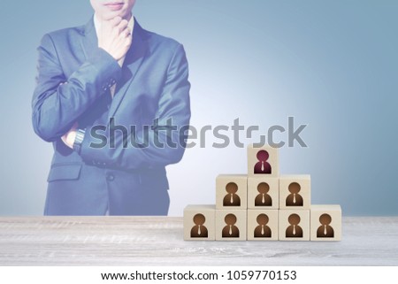 Businessman Thinking & Look at Wood Cube Block on Top Pyramid, Human Resource Management and Recruitment Business Concept.