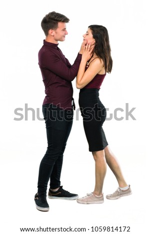 Young teenager couple hugging on isolated white background