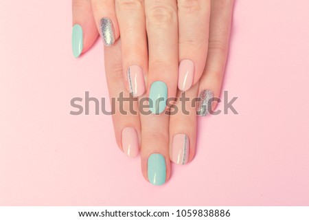 Pink and blue manicure design with silver line . Beautiful nails Royalty-Free Stock Photo #1059838886