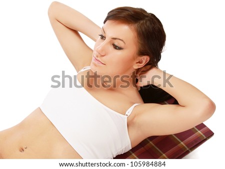 Woman doing strength exercises for abdominal muscles, isolated on white background