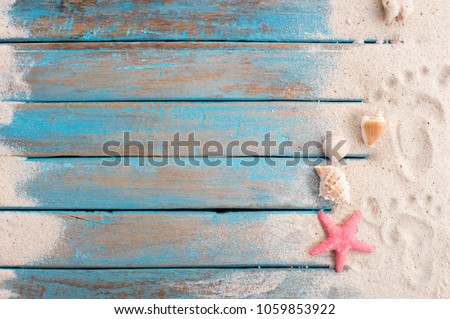 Sand on the wooden floor and decorated with shells, like walking on a beach vacation.