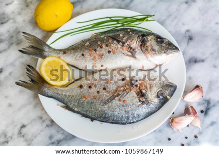 Fresh Raw Sea Bream Fish with Lemon