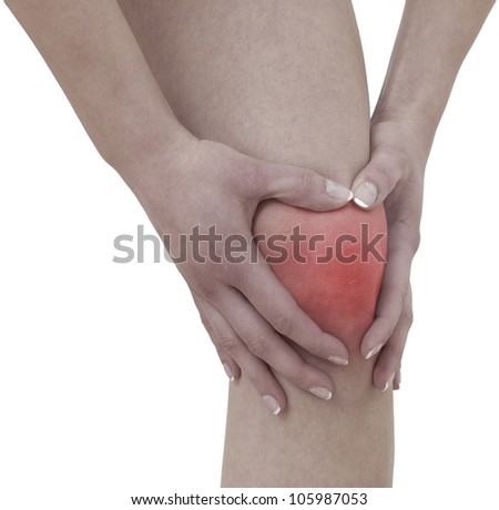 Acute pain in a woman  knee. Female holding hand to spot of knee-aches.