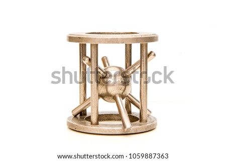 A picture of the traditional mechanical puzzle the "Hedgehog in cage".  