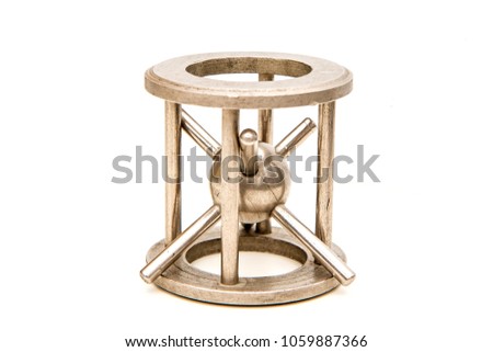 A picture of the traditional mechanical puzzle the "Hedgehog in cage".  