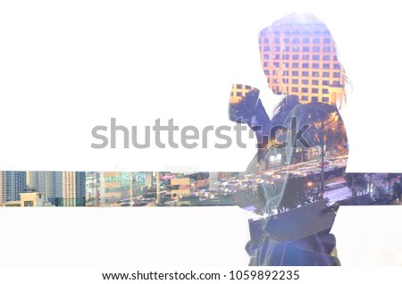 There is a picture of the city in the shadow of a woman.