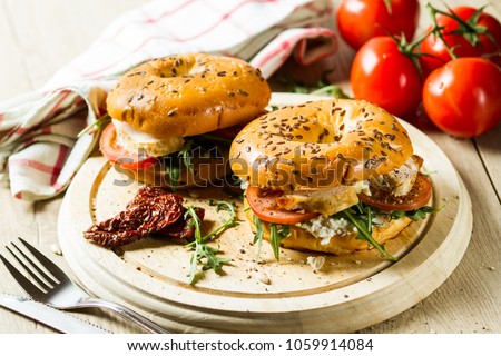 Bagel with chicken and cream cheese Royalty-Free Stock Photo #1059914084