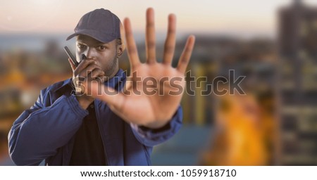 Security man outside with city background