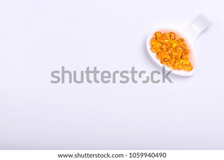 A plate of the cod  liver oil and fish oil.