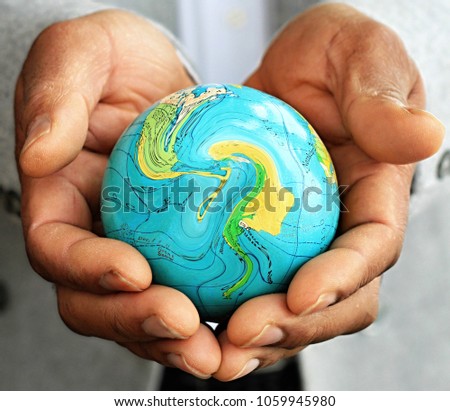 hand holding globe on earth day people with grey background stock image and stock photo