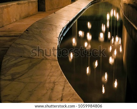night light reflection in summer fountain pool party