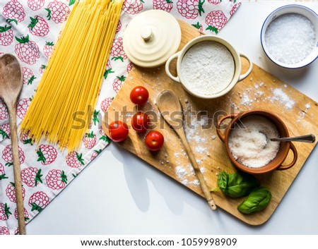 Food photography. Pasta scene with ingredients. Suitable for presentation background, slides and behind text because of wide white space