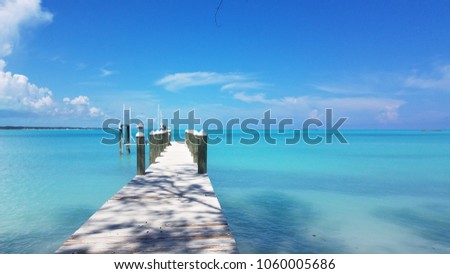 Beautiful Dock looking out to perfect turquoise waters on a secluded beach in Exuma Bahamas