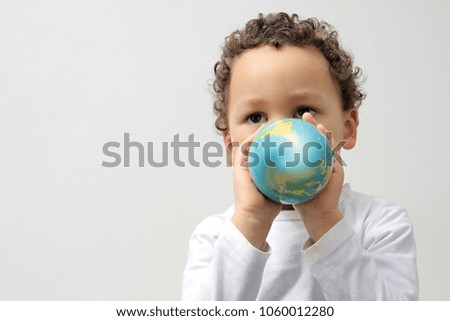 boy with globe on earth day smiling people with white background stock image and stock photo