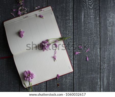 Background with flowers and notebook and free space