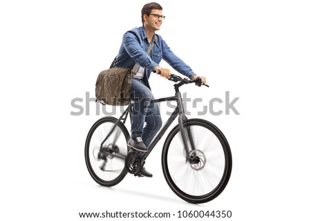 Young guy riding a bicycle isolated on white background