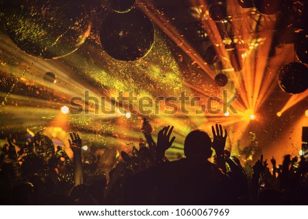 dj night club party rave with crowd in music festive Royalty-Free Stock Photo #1060067969