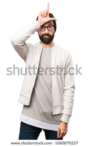 Hipster man making loser sign on white background