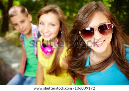 Cool teenagers hanging out together on summer vacation