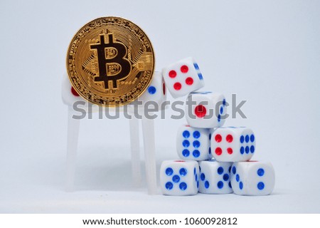 Golden bitcoin and dice with white background. 