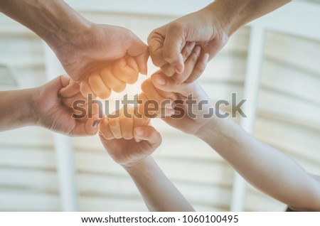 teamwork concept of diversity multiethnic people with group hands bump for relationship and together.
