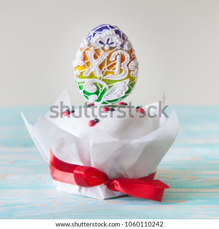 Russian Orthodox Easter. White and pink background. Easter cake, Easter bunny, colored eggs.