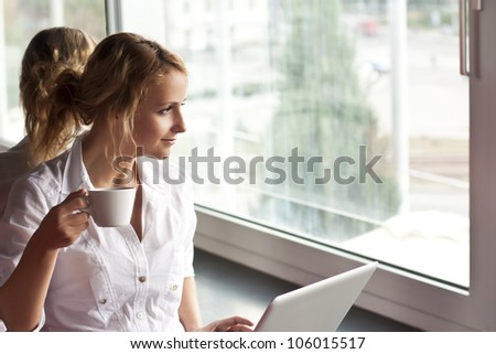 Picture of pensive woman with laptop computer