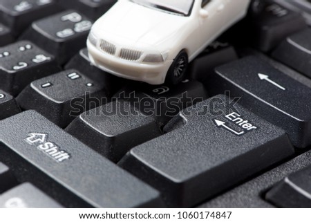 Car model on the black keyboard in selective focus, Concept: Car, Online market, Buying, second had, rental. Royalty-Free Stock Photo #1060174847