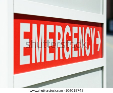A red Emergency sign at the entrance to a hospital