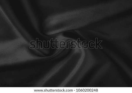 Soft focus cloth silk black. Take home this black washed silk! The washed black color is a soft, silky hand. Thin and light, it has a liquid drape that stands out when creating soft silhouettes.