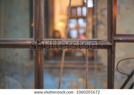 Glass window with blur vintage background. How mysterious it is. Abstract photo, defocus photo