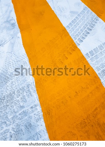 Yellow and white background with dirty tread texture.