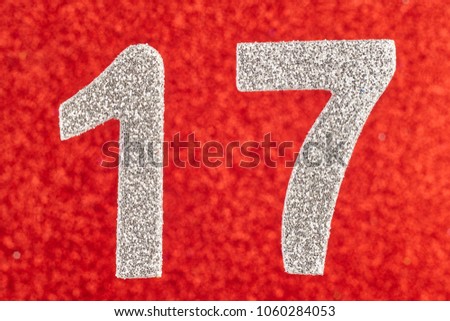 Number seventeen silver color over a red background. Anniversary. Horizontal