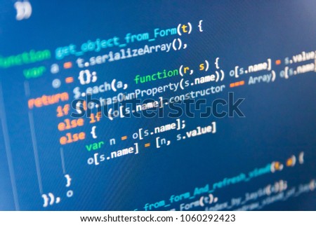 HTML5 in editor for website development. Mobile app developer. Abstract IT technology background.  Desktop PC monitor photo. Abstract screen of software. Monitor closeup of function source code. 
