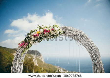 arch for newlyweds on the background of the sea
