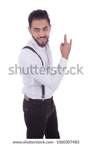 Handsome young man wearing a classic outfit and doing rock and roll sign, isolated on white background