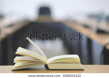 Close-up of open books on meeting table selective focus and shallow depth of field