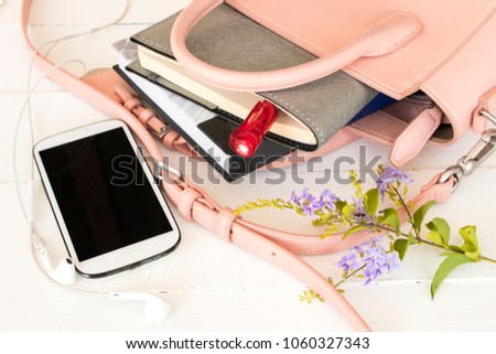 notebook planner with pink bag of lifestyle woman for business on white