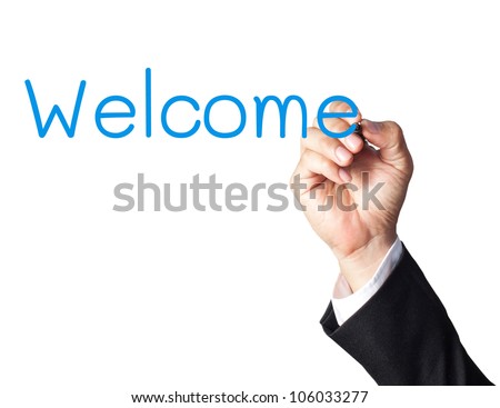 businessman hand writing welcome on white board
